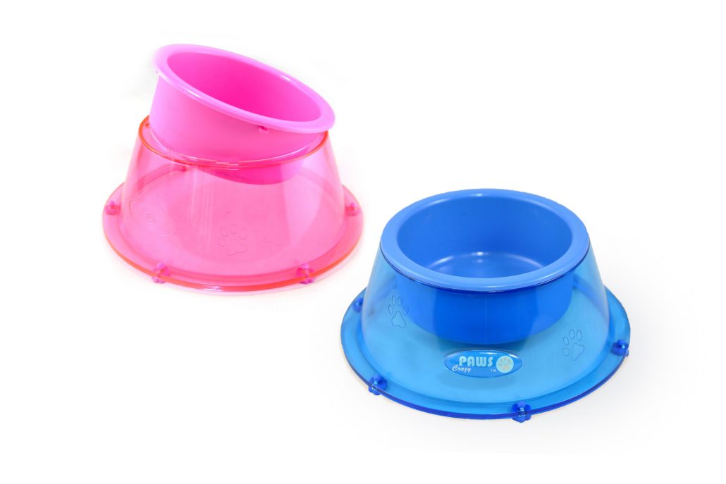 Two plastic bowls on a white surface.