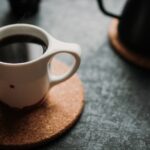 selective focus photograph of white mug filled with coffee